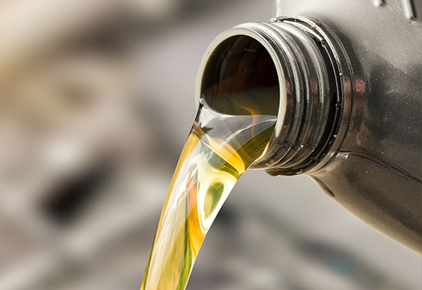 oil being poured during car oil change service