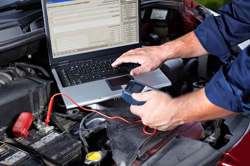 preventive auto maintenance being performed on car