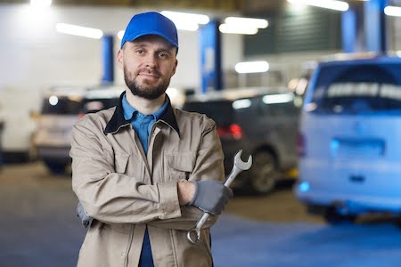 Visalia mechanic standing in an auto shop